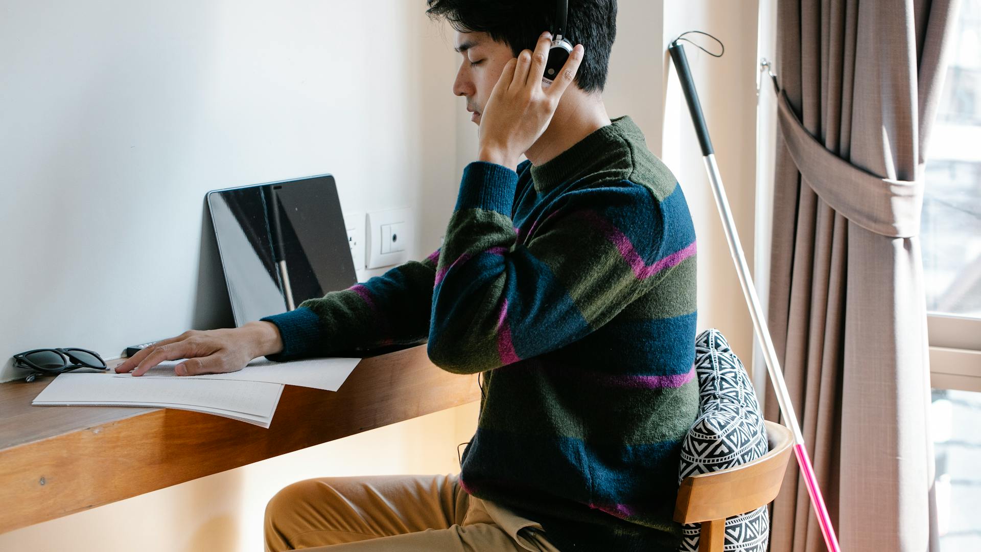 Eye Spy Volunteer Blind Man At Desk On The Phone